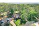 Aerial view of a home with a well-manicured lawn, beautiful landscaping, and mature trees at 1991 River Forest Dr, Marietta, GA 30068