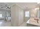 Bright bathroom with double sinks, white cabinets, and a shower visible through an open doorway at 1991 River Forest Dr, Marietta, GA 30068