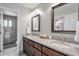 Bathroom featuring granite countertop vanity, framed mirrors and doorway to a shower at 1991 River Forest Dr, Marietta, GA 30068