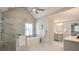 Modern bathroom boasts a soaking tub, walk-in shower with glass door, and a sleek vanity at 1991 River Forest Dr, Marietta, GA 30068