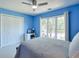 Light blue bedroom with a window view and an area to set up a home office at 1991 River Forest Dr, Marietta, GA 30068