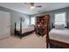 Bedroom with two twin beds, a built-in desk, ceiling fan and neutral-colored walls at 1991 River Forest Dr, Marietta, GA 30068