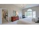 Bright bedroom features a large window and an ensuite bathroom with a view of the backyard at 1991 River Forest Dr, Marietta, GA 30068