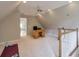 Spacious bonus room with a desk and staircase with views of the main living space at 1991 River Forest Dr, Marietta, GA 30068