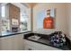 Butler's pantry shows dry bar with wine storage, sink, and window into living room with fireplace at 1991 River Forest Dr, Marietta, GA 30068