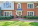 Elegant brick home featuring a covered front entry and manicured landscaping at 1991 River Forest Dr, Marietta, GA 30068