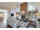 Vaulted living room with a stone fireplace and built-in shelving creates a cozy yet elegant ambiance at 1991 River Forest Dr, Marietta, GA 30068