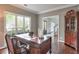 Office space with hardwood floors, large windows, and custom desk at 1991 River Forest Dr, Marietta, GA 30068