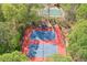 Aerial view of tennis courts surrounded by lush trees offering a private recreational space at 1991 River Forest Dr, Marietta, GA 30068