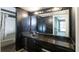 Dark-themed bathroom featuring a vanity with mirror and a shower with a curtain at 4964 N Ellipse Dr, Marietta, GA 30068