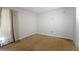 Bedroom with neutral walls and carpeting, a window, and a side door at 4964 N Ellipse Dr, Marietta, GA 30068