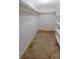 Spacious walk-in closet with white shelving and neutral carpeting at 4964 N Ellipse Dr, Marietta, GA 30068