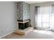 Close up of the stone fireplace featuring decorative accents and natural light at 4964 N Ellipse Dr, Marietta, GA 30068
