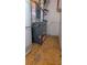 A gray furnace sits next to a white hot water heater on a light brown linoleum floor at 4964 N Ellipse Dr, Marietta, GA 30068