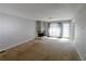 Cozy living room with stone fireplace and large window providing ample sunlight at 4964 N Ellipse Dr, Marietta, GA 30068