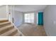Living room with large window and blue curtain, showcasing natural light at 4964 N Ellipse Dr, Marietta, GA 30068