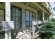 A patio with an exterior door, a window, and gray wooden railings at 4964 N Ellipse Dr, Marietta, GA 30068