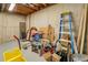 View of the cluttered basement with various tools and items at 460 Haynes Creek Circle, Oxford, GA 30054