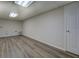 View of the basement that has a door and flooring at 460 Haynes Creek Circle, Oxford, GA 30054