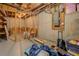 View of unfinished basement with concrete walls, wooden beams, and utilities at 460 Haynes Creek Circle, Oxford, GA 30054