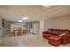 Finished basement featuring tile flooring, kitchenette, dining area, and comfortable seating at 460 Haynes Creek Circle, Oxford, GA 30054