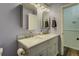 Elegant bathroom with a double vanity, white countertops, and framed mirrors with sconces at 460 Haynes Creek Circle, Oxford, GA 30054