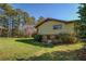 View of the rear exterior with trees at 460 Haynes Creek Circle, Oxford, GA 30054