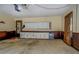 Spacious garage featuring white cabinets along the back wall at 460 Haynes Creek Circle, Oxford, GA 30054