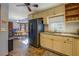 Bright kitchen adjacent to the breakfast nook featuring white cabinets and stainless steel refrigerator at 460 Haynes Creek Circle, Oxford, GA 30054