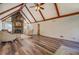 Spacious living room with vaulted ceilings, stone fireplace, and abundant natural light at 460 Haynes Creek Circle, Oxford, GA 30054