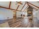Inviting living room featuring hardwood floors, stone fireplace, and comfortable seating at 460 Haynes Creek Circle, Oxford, GA 30054
