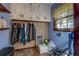 Organized mud room with cabinets and a clothing rack for storage at 460 Haynes Creek Circle, Oxford, GA 30054