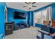 Bedroom featuring blue walls, carpeted floors, and a ceiling fan at 5462 S Crest Ridge S Dr, Ellenwood, GA 30294