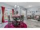 Bright dining area with hardwood floors, stylish decor, and ample natural light, perfect for casual meals at 5462 S Crest Ridge S Dr, Ellenwood, GA 30294