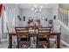 Charming dining area with hardwood floors, a modern chandelier, and comfortable seating for Gathering meals at 5462 S Crest Ridge S Dr, Ellenwood, GA 30294