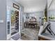 Elegant dining room with stylish decor, featuring a wooden table, seating for six, and ample natural light at 5462 S Crest Ridge S Dr, Ellenwood, GA 30294