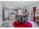 Open-concept kitchen featuring white cabinets, an island with seating, and modern appliances, perfect for entertaining at 5462 S Crest Ridge S Dr, Ellenwood, GA 30294