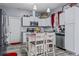Well-lit kitchen features white cabinets, stainless steel appliances, granite countertops, and a central island with seating at 5462 S Crest Ridge S Dr, Ellenwood, GA 30294