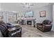 Cozy living room with fireplace, hardwood floors, comfortable seating, and natural light, ideal for relaxation at 5462 S Crest Ridge S Dr, Ellenwood, GA 30294