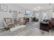 Spacious living room featuring a fireplace, hardwood floors, elegant decor, and ample seating for entertaining at 5462 S Crest Ridge S Dr, Ellenwood, GA 30294
