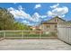 Relax on this wooden deck with backyard views, under a bright blue sky with fluffy clouds at 6206 Carriage Gate Se Ln # 6, Mableton, GA 30126