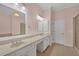 This bathroom has dual sinks, a shower, and a sleek tiled floor at 6206 Carriage Gate Se Ln # 6, Mableton, GA 30126