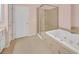 This bathroom features a luxurious soaking tub and separate shower for a spa-like retreat at 6206 Carriage Gate Se Ln # 6, Mableton, GA 30126