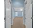 Entering this bedroom reveals neutral carpet, a ceiling fan and bright natural light from shuttered windows at 6206 Carriage Gate Se Ln # 6, Mableton, GA 30126