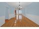 Elegant dining room with hardwood floors, chair rail, and decorative chandelier at 6206 Carriage Gate Se Ln # 6, Mableton, GA 30126