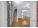 Inviting foyer with hardwood floors leading into a light-filled living space and view of staircase at 6206 Carriage Gate Se Ln # 6, Mableton, GA 30126