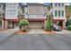 Townhouse featuring garages, covered patios, and neatly manicured landscaping at 6206 Carriage Gate Se Ln # 6, Mableton, GA 30126