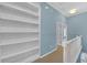 Bright hallway featuring custom built-in shelving and white trim at 6206 Carriage Gate Se Ln # 6, Mableton, GA 30126