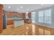 Spacious kitchen featuring hardwood floors, stainless steel appliances, and a large island at 6206 Carriage Gate Se Ln # 6, Mableton, GA 30126