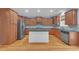 Beautiful kitchen with hardwood floors, stainless steel appliances, granite counters, and center island at 6206 Carriage Gate Se Ln # 6, Mableton, GA 30126